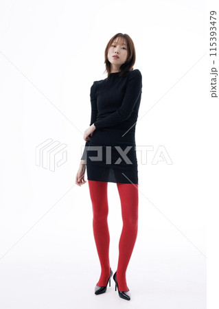 Korean Woman Poses in Black Dress and Red Leggings Korean Woman Poses in Black Dress and Red Leggings 115393479