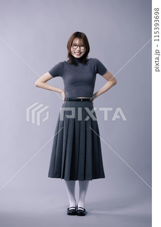 A Korean Woman in Her 20s Poses in a Neat Gray Costume With Glasses A Korean Woman in Her 20s Poses in a Neat Gray Costume With Glasses 115393698