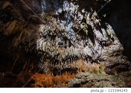 interior view of cave with stalactites and stalagmites 115394245