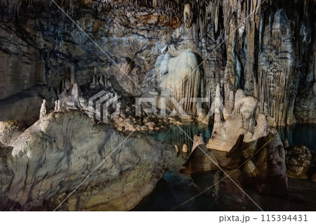 underground Cenote Choj Ha. Cave with stalactites and stalagmites. Valladolid, Mexico 115394431