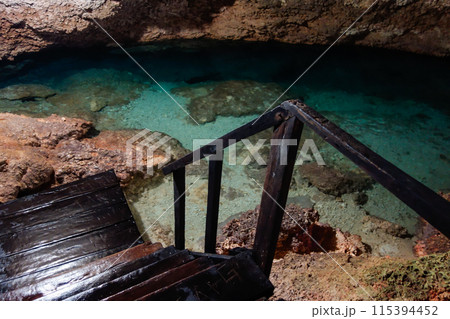 incredible natural pool of clear waters of cenote in Coba, Mexico 115394452