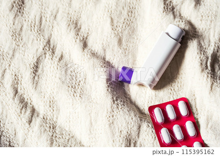 Asthma inhaler and antihistamine pills to prevent seasonal allergies.. Asthma inhaler and antihistamine pills to prevent seasonal allergies.. 115395162