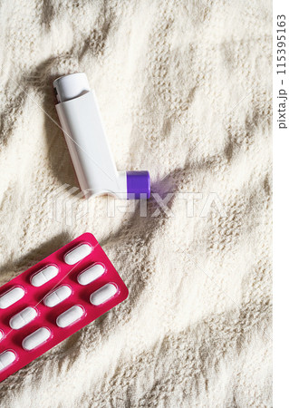 Asthma inhaler and antihistamine pills to prevent seasonal allergies.. Asthma inhaler and antihistamine pills to prevent seasonal allergies.. 115395163