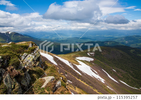 Spectacular view of mountains covered with snow in summer Spectacular view of mountains covered with snow in summer 115395257
