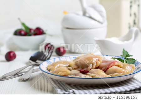 Homemade cherry dumplings . 115396155