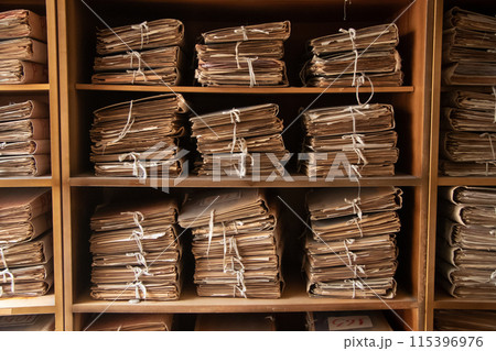 Old archive. Shelves with old document folders. 115396976