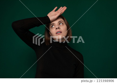 Woman in Black Turtle Neck Top Holding Hands to Head 115398906