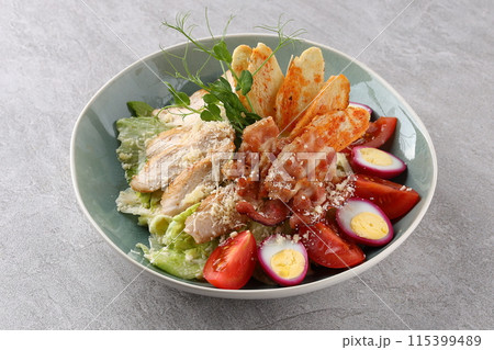 Caesar Salad: Classic salad with romaine lettuce, croutons, Parmesan, and Caesar dressing. 115399489