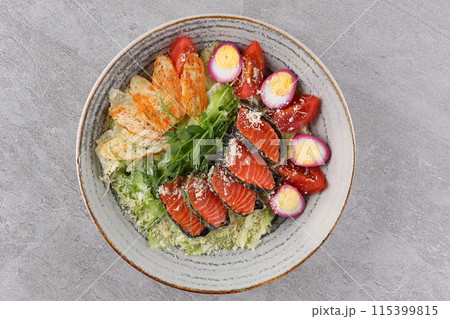 Salad with salmon, lettuce and balsamic vinegar. Healthy food, fresh green salad. 115399815