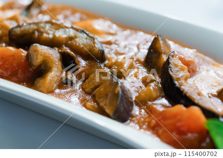 Stewed meat with vegetables and mushrooms Stewed meat with vegetables and mushrooms 115400702