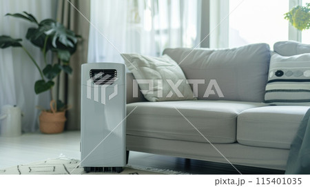 portable air conditioner or mobile air cooler in modern living room 115401035