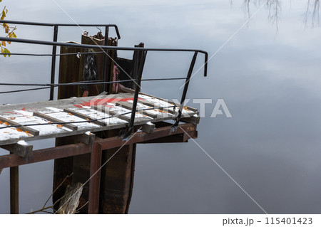 Small pier covered with snow at Ladoga lake coast Small pier covered with snow at Ladoga lake coast 115401423