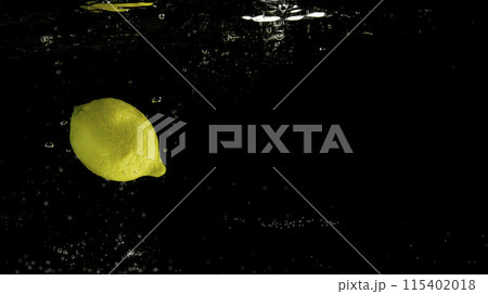 Fresh fruit falling into the water. Organic fruits for making effective juices for dieting. 115402018