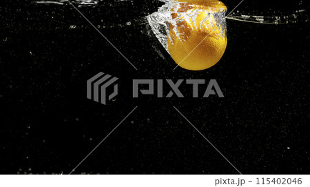 Fresh fruit falling into the water. Organic fruits for making effective juices for dieting. 115402046