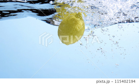 Fresh fruit falling into the water. Organic fruits for making effective juices for dieting. 115402194