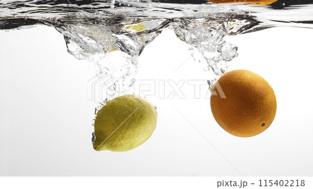 Fresh fruit falling into the water. Organic fruits for making effective juices for dieting. Fresh fruit falling into the water. Organic fruits for making effective juices for dieting. 115402218