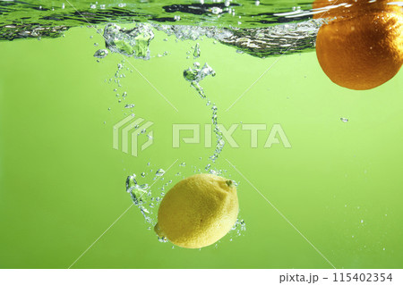 Fresh fruit falling into the water. Organic fruits for making effective juices for dieting. 115402354