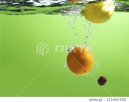 Fresh fruit falling into the water. Organic fruits for making effective juices for dieting. Fresh fruit falling into the water. Organic fruits for making effective juices for dieting. 115402356