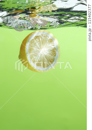 Fresh fruit falling into the water. Organic fruits for making effective juices for dieting. 115402377
