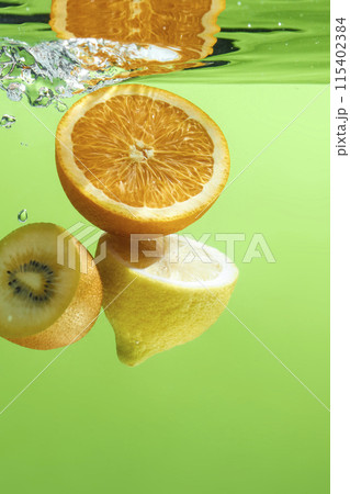 Fresh fruit falling into the water. Organic fruits for making effective juices for dieting. Fresh fruit falling into the water. Organic fruits for making effective juices for dieting. 115402384