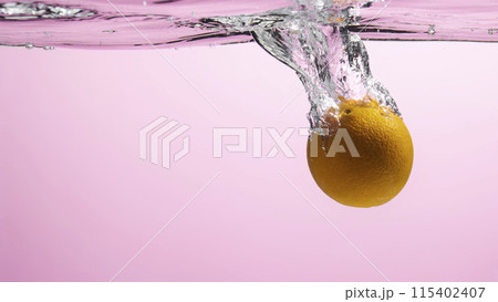 Fresh fruit falling into the water. Organic fruits for making effective juices for dieting. 115402407