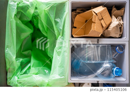 Household bins for waste sorting in the kitchen for recycle. Plastic, paper, bio and mixed waste. Sorting waste at home concept Household bins for waste sorting in the kitchen for recycle. Plastic, paper, bio and mixed waste. Sorting waste at home concept 115405106