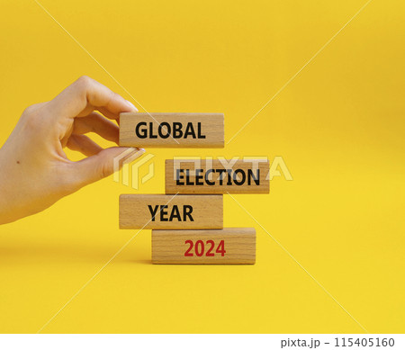Global Election year 2024 symbol. Concept words Global Election year 2024 on wooden blocks. Beautiful yellow background. Businessman hand. Business and Global Election year 2024 concept. Copy space Global Election year 2024 symbol. Concept words Global Election year 2024 on wooden blocks. Beautiful yellow background. Businessman hand. Business and Global Election year 2024 concept. Copy space 115405160
