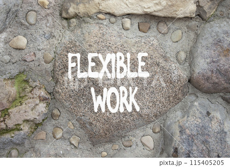 Flexible work symbol. Stone wall with words Flexible work. Beautiful stone background. Business and Flexible work concept. Copy space. 115405205