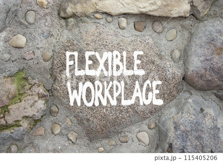 Flexible workplace symbol. Stone wall with words Flexible workplace. Beautiful stone background. Business and Flexible workplace concept. Copy space. 115405206