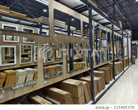 A warehouse packed with numerous mirrors and boxes A warehouse packed with numerous mirrors and boxes 115405370