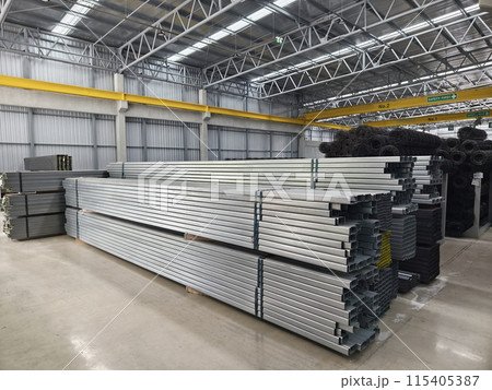 A big warehouse packed with numerous metallic nets and profile A big warehouse packed with numerous metallic nets and profile 115405387