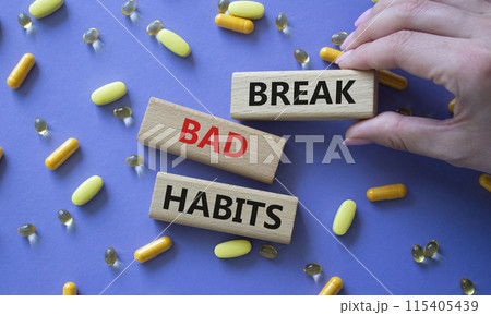 Break bad habits symbol. Concept words Break bad habits on wooden blocks. Beautiful purple background with pills. Doctor hand. Medicine and Break bad habits concept. Copy space. Break bad habits symbol. Concept words Break bad habits on wooden blocks. Beautiful purple background with pills. Doctor hand. Medicine and Break bad habits concept. Copy space. 115405439