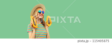 Summer portrait of happy cheerful young woman with fresh papaya fruits on green background Summer portrait of happy cheerful young woman with fresh papaya fruits on green background 115405875
