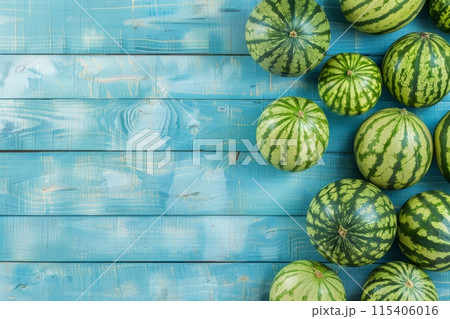 Fresh whole watermelons on a blue rustic wooden background 115406016