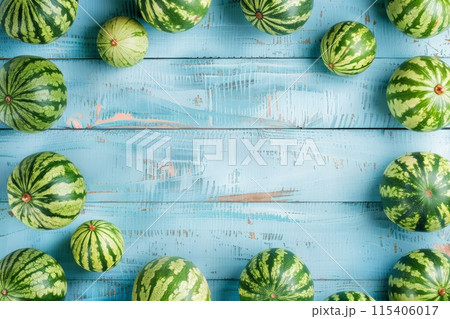Watermelons on a blue rustic wooden background 115406017