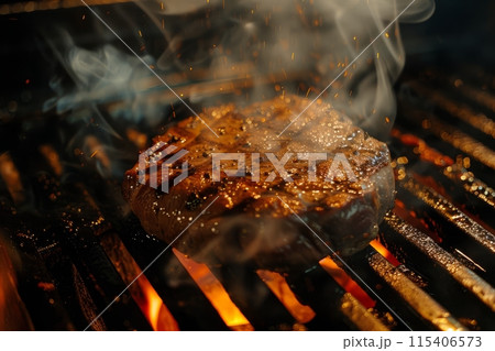 Juicy steak grilling over open flames 115406573