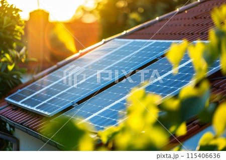Close-up of solar panels on a roof during a beautiful sunset, showcasing the potential of renewable energy for a sustainable future 115406636