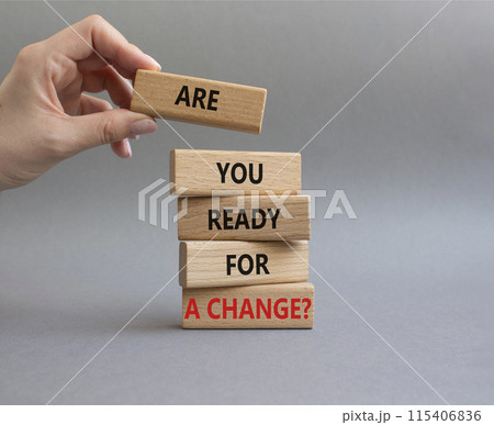Change symbol. Wooden blocks with words Are you ready for a new change. Businessman hand. Beautiful grey background. Business and change concept. Copy space. Change symbol. Wooden blocks with words Are you ready for a new change. Businessman hand. Beautiful grey background. Business and change concept. Copy space. 115406836