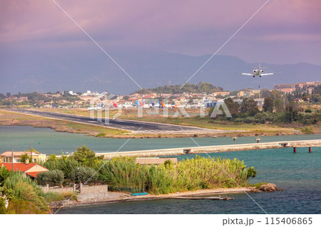 Airplane Landing Over Coastline, Corfu, Greece 115406865