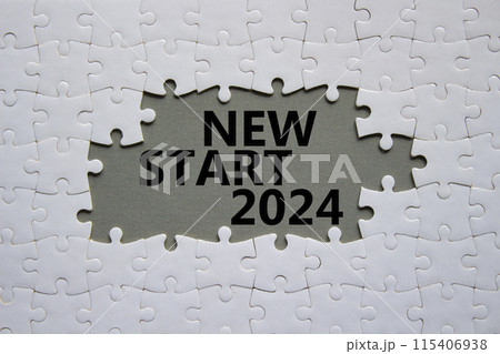 New Start 2024 symbol. Concept words New Start 2024 on white puzzle. Beautiful grey background. Business and New Start 2024 concept. Copy space. 115406938