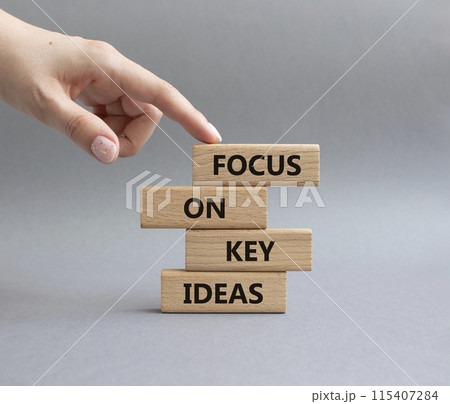Focus on Key Ideas symbol. Concept words Focus on Key Ideas on wooden blocks. Beautiful grey background. Businessman hand. Business and Focus on Key Ideas concept. Copy space Focus on Key Ideas symbol. Concept words Focus on Key Ideas on wooden blocks. Beautiful grey background. Businessman hand. Business and Focus on Key Ideas concept. Copy space 115407284