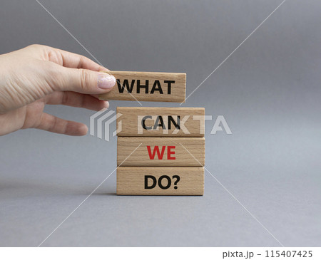 What can we do symbol. Wooden blocks with words What can we do. Businessman hand. Beautiful grey background. Business and What can we do concept. Copy space. 115407425