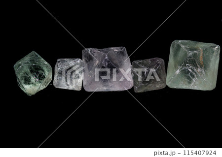 macro mineral fluorite stone on balck background macro mineral fluorite stone on balck background 115407924