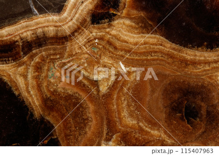 Macro stone mineral onyx marble on a black background Macro stone mineral onyx marble on a black background 115407963
