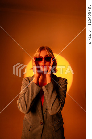 Fashionable portrait of blonde lady in sunglasses posing. Fashionable portrait of blonde lady in sunglasses posing. 115408781