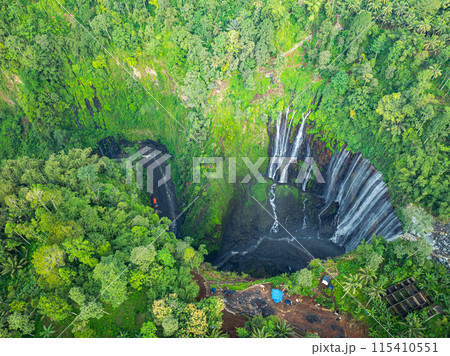 .Aerial view Thousands of waterfalls flow together at Tumpak Sewu Waterfall .Aerial view Thousands of waterfalls flow together at Tumpak Sewu Waterfall 115410551