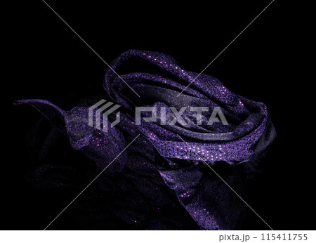 Purple violet glitter fabric flying in curve shape, Piece of textile Purple violet glitter fabric throw fall in air. Black background isolated, dark shading environment Purple violet glitter fabric flying in curve shape, Piece of textile Purple violet glitter fabric throw fall in air. Black background isolated, dark shading environment 115411755