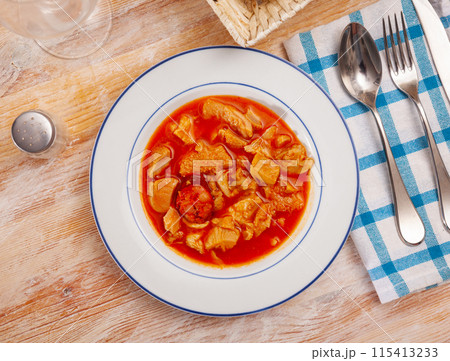 Soup from tasty boiled beef tripe with chorizo at plate Soup from tasty boiled beef tripe with chorizo at plate 115413233
