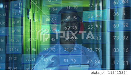 Image of financial data processing over male african american it engineer with tablet Image of financial data processing over male african american it engineer with tablet 115415834