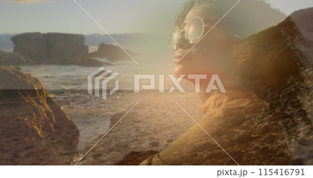 Image of african american woman in sunglasses over sunny landscape Image of african american woman in sunglasses over sunny landscape 115416791